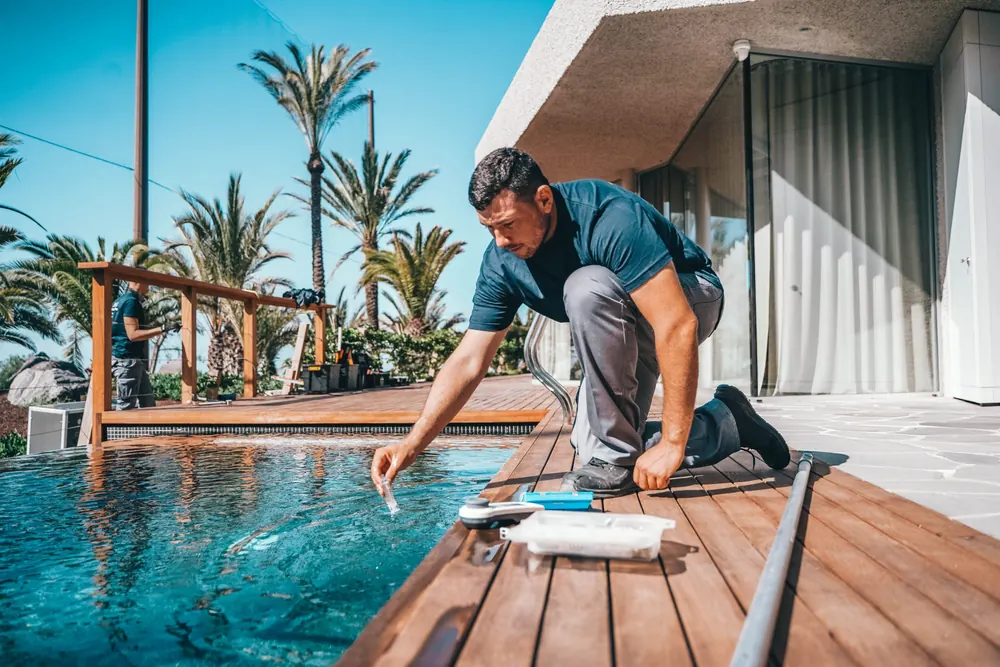Tenerife Pools technician testing pool water